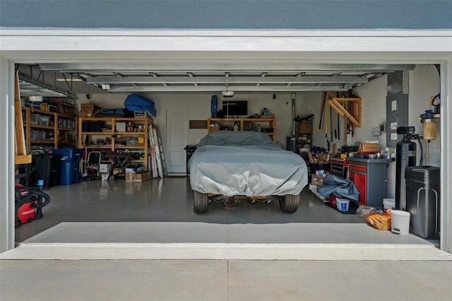 4407 Big Woods Way, Parrish, FL 34219 - garage with electric panel and a workshop area