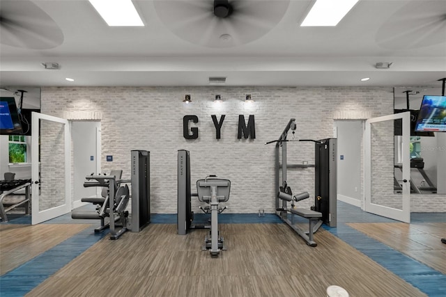 4407 Big Woods Way, Parrish, FL 34219 - gym featuring french doors, wood finished floors, recessed lighting, a ceiling fan, and baseboards