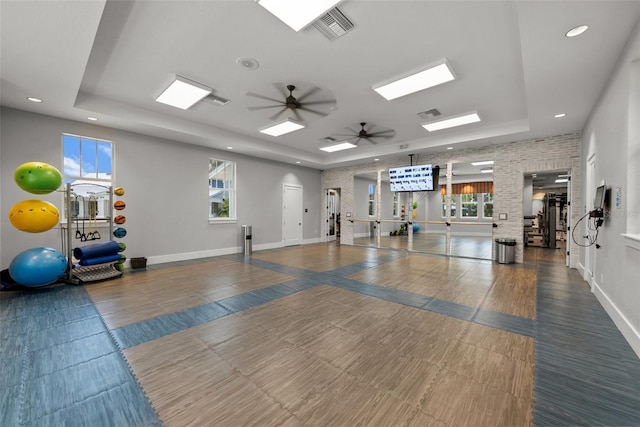 4407 Big Woods Way, Parrish, FL 34219 - workout area with a raised ceiling, a ceiling fan, plenty of natural light, recessed lighting, and baseboards