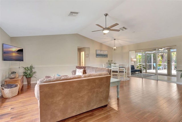 4322 Concert St, Port Charlotte, FL 33948 - living area featuring ceiling fan, wood finished floors, and vaulted ceiling