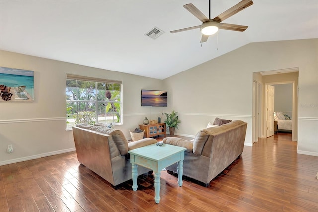 4322 Concert St, Port Charlotte, FL 33948 - living area featuring vaulted ceiling, wood finished floors, ceiling fan, and baseboards