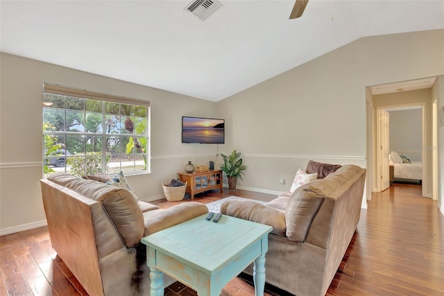 4322 Concert St, Port Charlotte, FL 33948 - living area featuring vaulted ceiling, wood finished floors, baseboards, and a ceiling fan