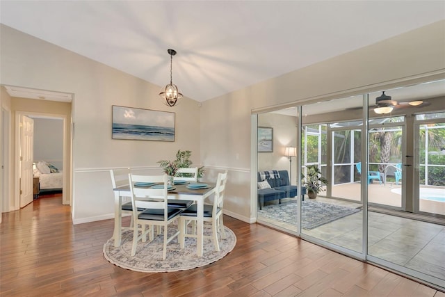 4322 Concert St, Port Charlotte, FL 33948 - dining area with wood finished floors, baseboards, and vaulted ceiling