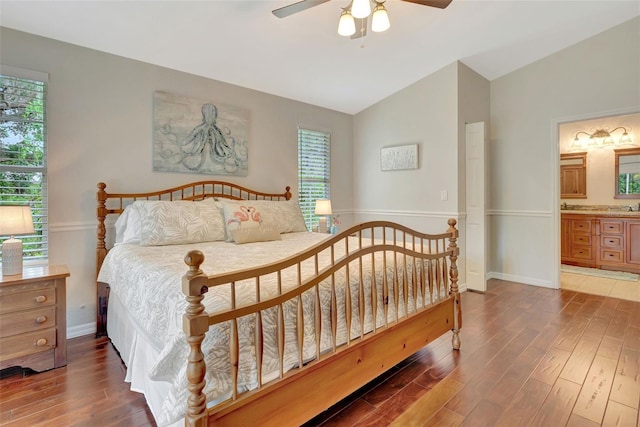4322 Concert St, Port Charlotte, FL 33948 - bedroom featuring lofted ceiling, wood finished floors, baseboards, ensuite bath, and ceiling fan