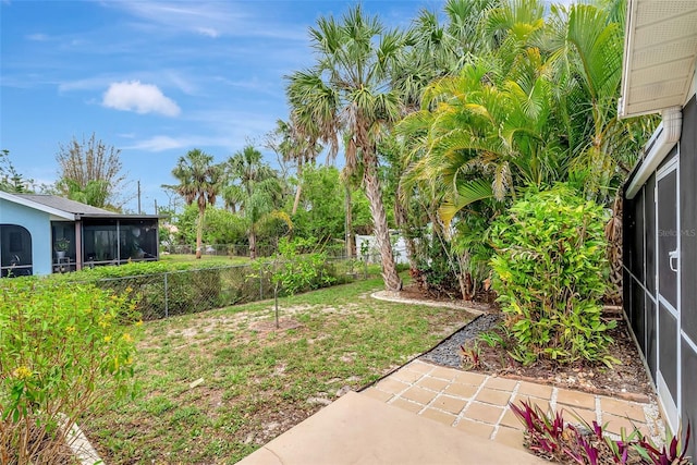 4322 Concert St, Port Charlotte, FL 33948 - fenced backyard featuring a sunroom