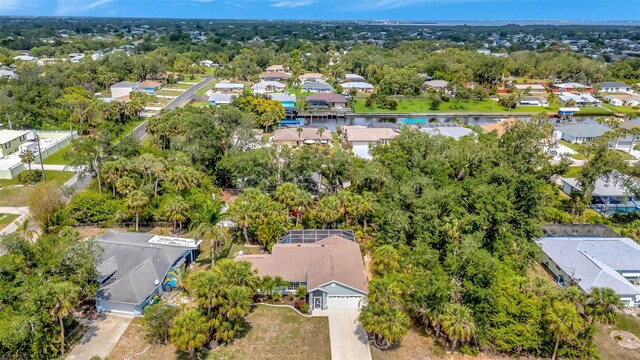 4322 Concert St, Port Charlotte, FL 33948 - aerial perspective of suburban area with a tree filled landscape