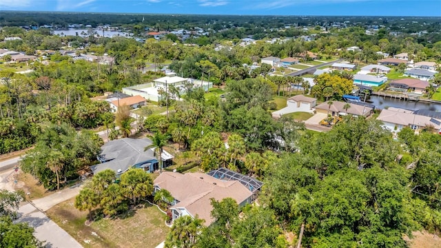 4322 Concert St, Port Charlotte, FL 33948 - aerial view of residential area with a large body of water and a tree filled landscape