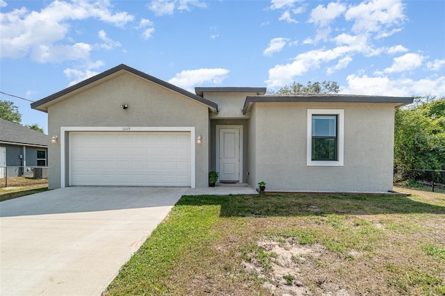 1229 Zinnia Loop, Labelle, FL 33935 - single story home featuring stucco siding, driveway, and an attached garage
