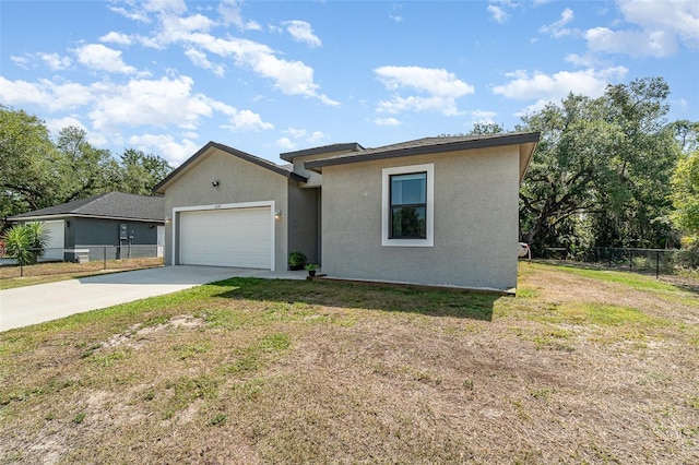 1229 Zinnia Loop, Labelle, FL 33935 - ranch-style house featuring a garage, concrete driveway, and stucco siding