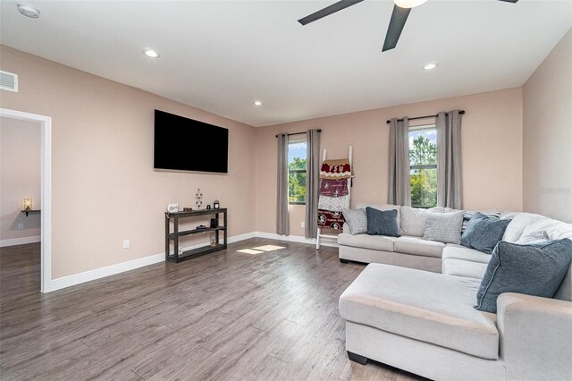 1229 Zinnia Loop, Labelle, FL 33935 - living area with healthy amount of natural light, wood finished floors, a ceiling fan, recessed lighting, and baseboards