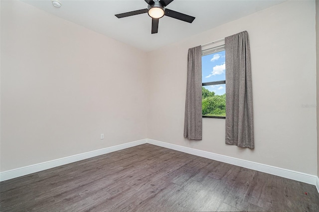 1229 Zinnia Loop, Labelle, FL 33935 - empty room with dark wood-style flooring, baseboards, and a ceiling fan