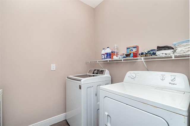 1229 Zinnia Loop, Labelle, FL 33935 - laundry area featuring washing machine and dryer and baseboards