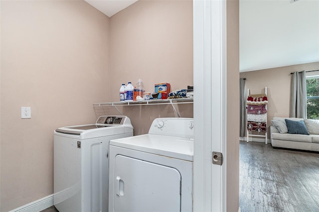 1229 Zinnia Loop, Labelle, FL 33935 - laundry room with washing machine and clothes dryer, baseboards, and light wood-type flooring