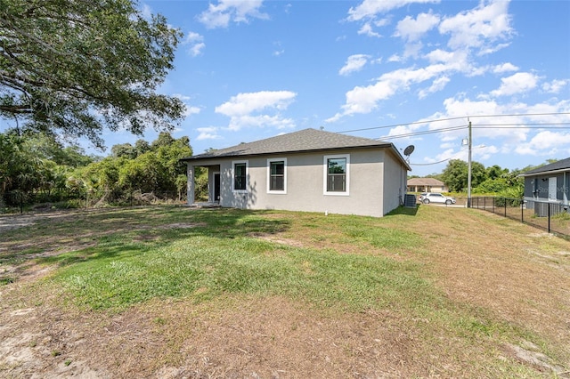 1229 Zinnia Loop, Labelle, FL 33935 - rear view of house featuring stucco siding
