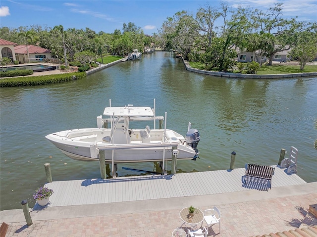 572 Commonwealth Ln, Sarasota, FL 34242 - dock area featuring a water view and boat lift