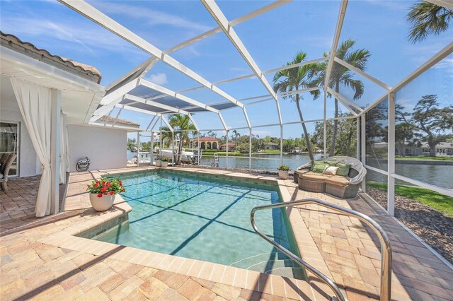 572 Commonwealth Ln, Sarasota, FL 34242 - outdoor pool featuring a patio, a water view, and glass enclosure