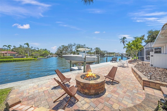 572 Commonwealth Ln, Sarasota, FL 34242 - view of patio featuring a fire pit, boat lift, a boat dock, and a water view