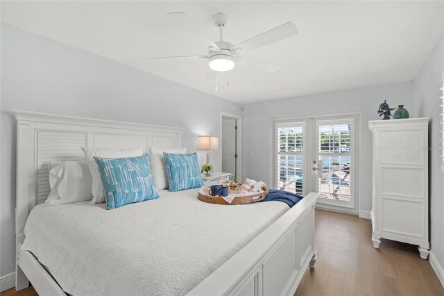 572 Commonwealth Ln, Sarasota, FL 34242 - bedroom featuring wood finished floors, access to exterior, french doors, baseboards, and ceiling fan