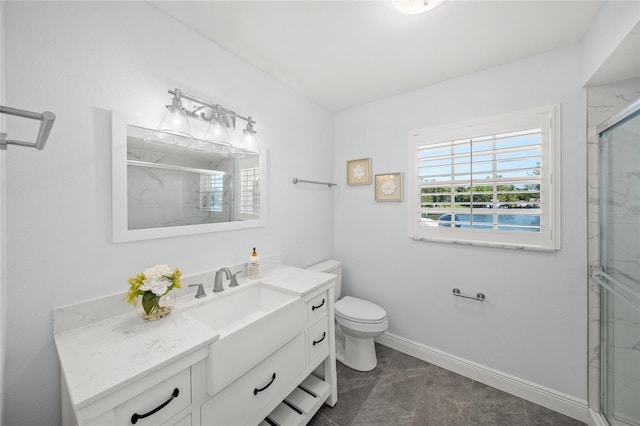 572 Commonwealth Ln, Sarasota, FL 34242 - full bath featuring vanity, toilet, a marble finish shower, and baseboards