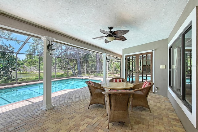 4917 Leatha Ln, Sarasota, FL 34232 - sunroom / solarium featuring a swimming pool, a ceiling fan, and french doors