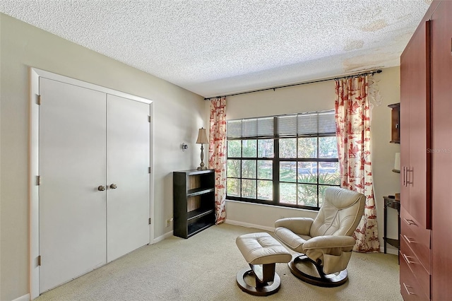 4917 Leatha Ln, Sarasota, FL 34232 - sitting room with light colored carpet, a textured ceiling, and baseboards