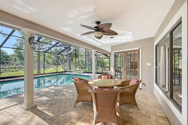 4917 Leatha Ln, Sarasota, FL 34232 - sunroom / solarium with a swimming pool, french doors, and ceiling fan