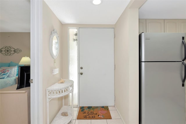 4650 Ringwood Mdw Unit 37, Sarasota, FL 34235 - entrance foyer featuring light tile patterned floors