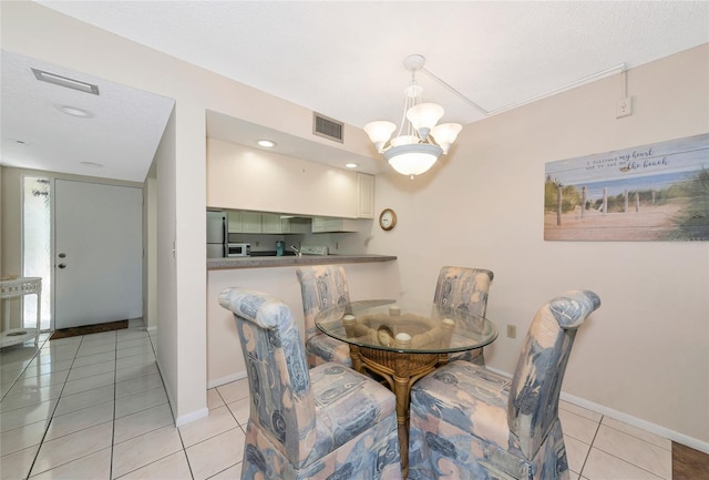 4650 Ringwood Mdw Unit 37, Sarasota, FL 34235 - dining area featuring baseboards, light tile patterned flooring, a chandelier, and recessed lighting