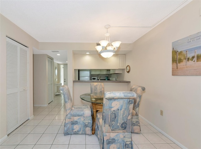4650 Ringwood Mdw Unit 37, Sarasota, FL 34235 - tiled dining space featuring a chandelier, baseboards, and recessed lighting