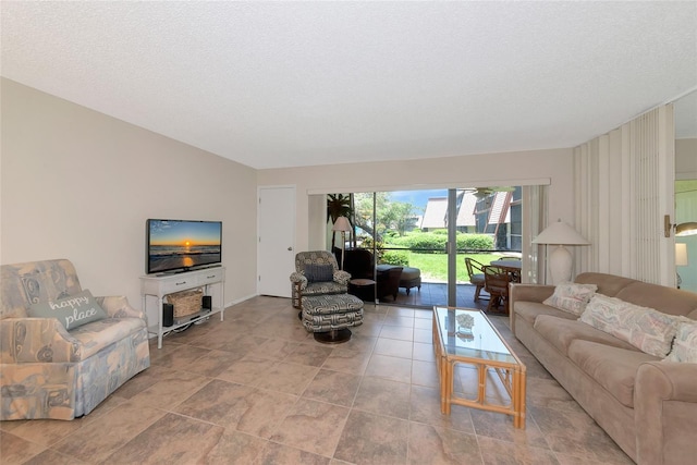 4650 Ringwood Mdw Unit 37, Sarasota, FL 34235 - living room with a textured ceiling