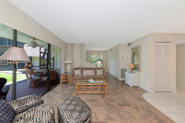 4650 Ringwood Mdw Unit 37, Sarasota, FL 34235 - living room featuring baseboards and a ceiling fan