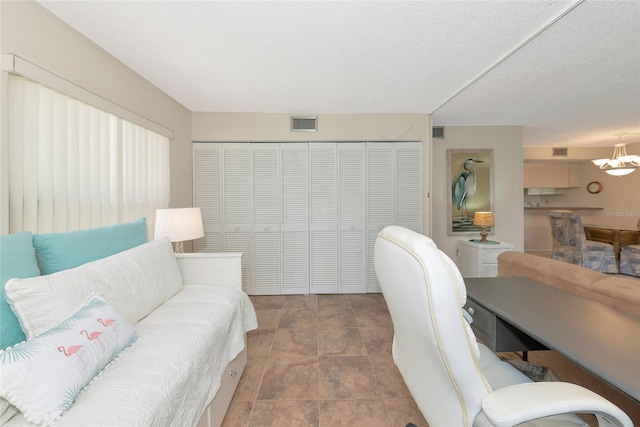 4650 Ringwood Mdw Unit 37, Sarasota, FL 34235 - office area featuring a chandelier and stone finish flooring