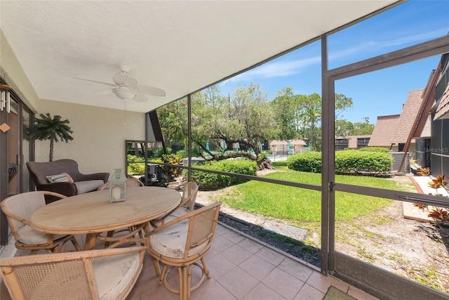 4650 Ringwood Mdw Unit 37, Sarasota, FL 34235 - sunroom / solarium featuring a ceiling fan and outdoor dining area