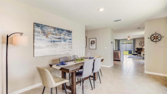 12060 Lansing Gln, Parrish, FL 34219 - dining space with baseboards, ceiling fan, and light tile patterned floors