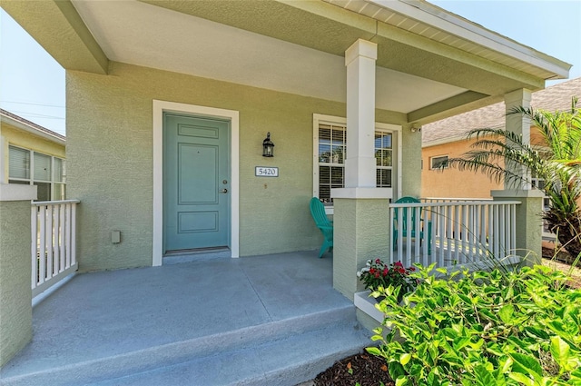 5420 River Sound Ter, Bradenton, FL 34208 - doorway to property with covered porch and stucco siding