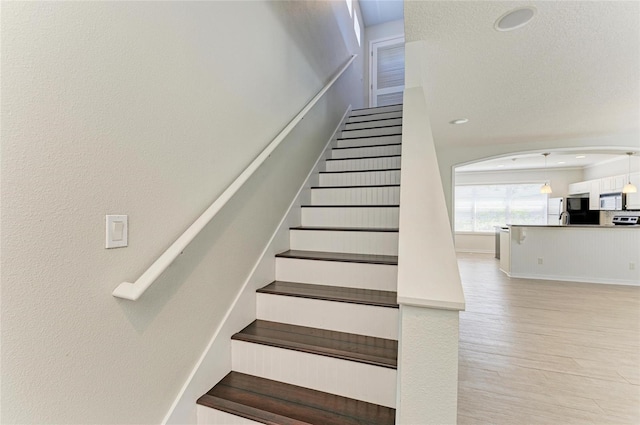 5420 River Sound Ter, Bradenton, FL 34208 - staircase featuring wood finished floors and recessed lighting