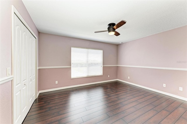 5420 River Sound Ter, Bradenton, FL 34208 - unfurnished bedroom with a closet, wood finished floors, baseboards, and a ceiling fan