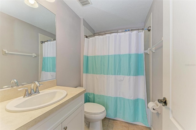 5420 River Sound Ter, Bradenton, FL 34208 - full bathroom featuring vanity, toilet, tile patterned flooring, a textured ceiling, and a shower with shower curtain