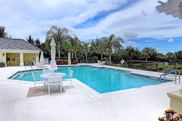 5420 River Sound Ter, Bradenton, FL 34208 - community pool featuring a patio and view of scattered trees