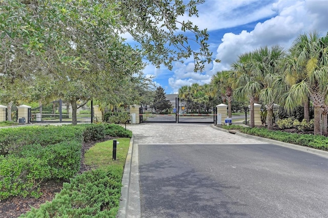 5420 River Sound Ter, Bradenton, FL 34208 - view of asphalt street with a gate, curbs, and a gated entry