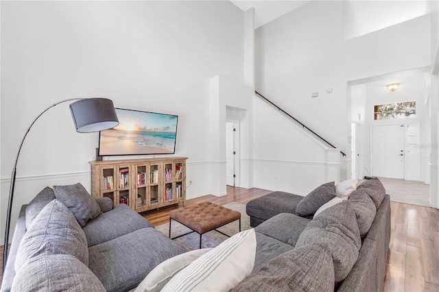 6032 36th Ct E, Ellenton, FL 34222 - living room featuring wood finished floors, stairs, and high vaulted ceiling