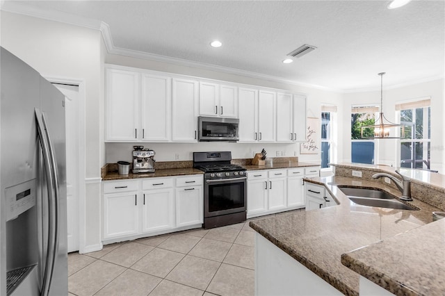 6032 36th Ct E, Ellenton, FL 34222 - kitchen featuring appliances with stainless steel finishes, a sink, crown molding, white cabinets, and recessed lighting