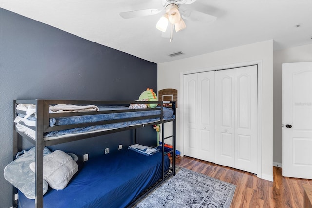 6032 36th Ct E, Ellenton, FL 34222 - bedroom featuring wood finished floors, a closet, ceiling fan, and baseboards