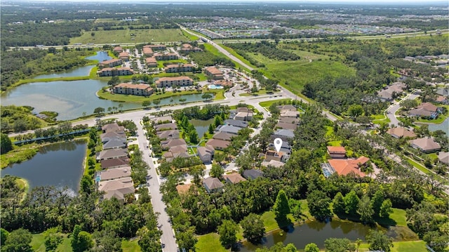 6032 36th Ct E, Ellenton, FL 34222 - aerial view of property and surrounding area featuring nearby suburban area and a large body of water