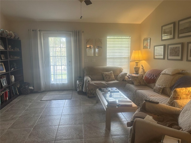 4027 Allure Ln, North Port, FL 34287 - living room with ceiling fan, stone tile floors, and lofted ceiling