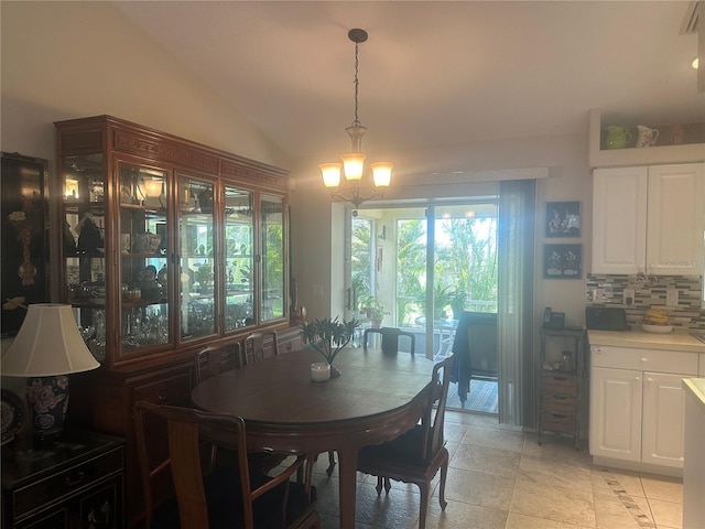 4027 Allure Ln, North Port, FL 34287 - dining area with a chandelier, lofted ceiling, and light tile patterned flooring