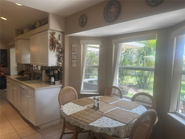 4027 Allure Ln, North Port, FL 34287 - dining space with light tile patterned floors and healthy amount of natural light
