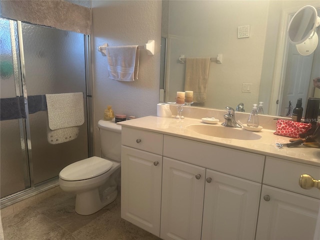4027 Allure Ln, North Port, FL 34287 - full bathroom with toilet, vanity, a stall shower, a textured wall, and tile patterned floors