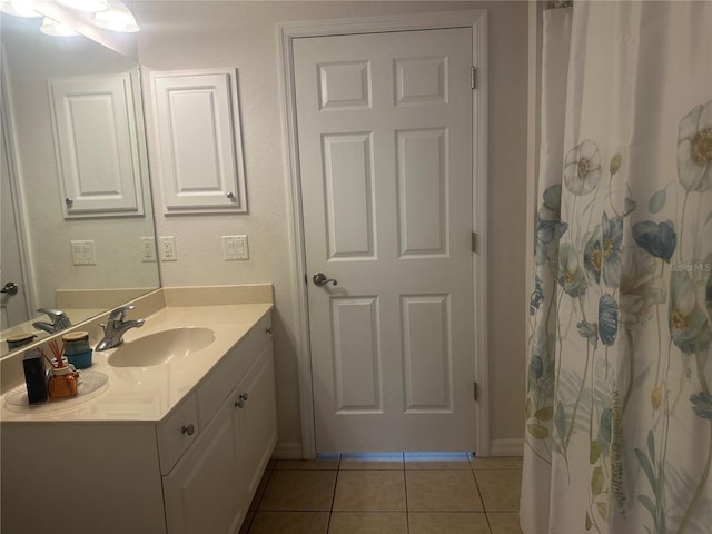 4027 Allure Ln, North Port, FL 34287 - full bathroom featuring vanity, tile patterned flooring, and baseboards