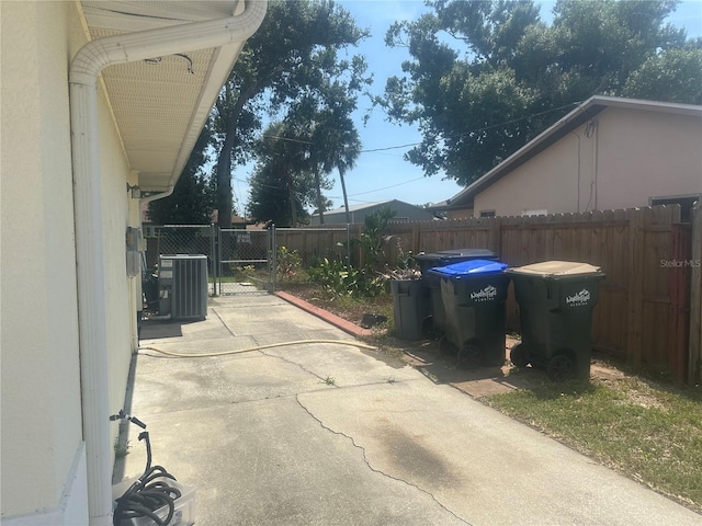 4027 Allure Ln, North Port, FL 34287 - view of patio / terrace featuring cooling unit and a gate